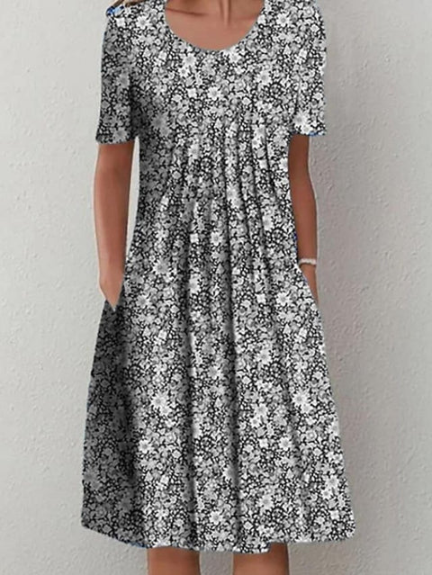 Frühling/Sommer Blumen bedrucktes Rundhals-Taschen-Mittellanges Kleid für Damenbekleidung m300037 