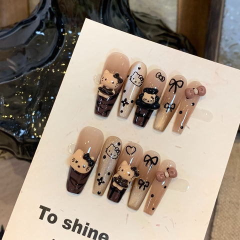 Handgetragene Maniküre in Premium Braun Hello Kitty Katzenauge Lang Weiß Abnehmbarer Fake Nagelaufkleber m3331216