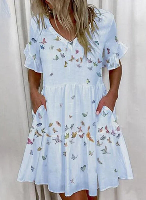 Kurzes Kleid mit Rüschen und Taschen und Print M300182 